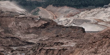 General view of the rebuilding site next to the collapsed iron ore waste dam of Brazilian mining company Samarco, in Mariana, Minas Gerais State, Brazil, on October 26, 2016.Next November 5 marks the first anniversary of the burst of the iron ore waste dam of Samarco -owned by BHP Billiton and Vale SA- which killed nineteen people and destroyed the ecosystem of the Doce River in the worst mining accident in Brazil's history. / AFP / YASUYOSHI CHIBA (Photo credit should read YASUYOSHI CHIBA/AFP/Getty Images)