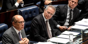 Supreme Court's Judge Gilmar Mendes (L), Senate's President Renan Calheiros (C) and Federal Judge Sergio Moro attend a public hearing on the bill that establishes the abuse of authority for judges and prosecutors, in the Senate in Brasilia on December 1, 2016.Even with a strong reaction against the bill from the public, Calheiros tries to speed up approval in the Senate and Lower House. The controversial law is ostensibly meant to crack down on undeclared election campaign funds, a common practice in Brazilian politics that has been linked to large-scale corruption. Judges and prosecutors have branded this as a weapon to reduce the judiciary's independence. / AFP / EVARISTO SA (Photo credit should read EVARISTO SA/AFP/Getty Images) Supreme Court's Judge Gilmar Mendes (L), Senate's President Renan Calheiros (C) and Federal Judge Sergio Moro attend a public hearing on the bill that establishes the abuse of authority for judges and prosecutors, in the Senate in Brasilia on December 1, 2016.Even with a strong reaction against the bill from the public, Calheiros tries to speed up approval in the Senate and Lower House. The controversial law is ostensibly meant to crack down on undeclared election campaign funds, a common practice in Brazilian politics that has been linked to large-scale corruption. Judges and prosecutors have branded this as a weapon to reduce the judiciary's independence. / AFP / EVARISTO SA (Photo credit should read EVARISTO SA/AFP/Getty Images)