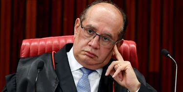 President of the Jury, Judge Gilmar Mendes, attends a meeting at the Supreme Electoral Court (TSE), on whether to invalidate the 2014 presidential election because of illegal campaign funding, in Brasilia, on April 4, 2017. 
Brazil's Supreme Electoral Court met Tuesday on whether to invalidate the 2014 presidential election because of illegal campaign funding -- a ruling that could in theory force out President Michel Temer. At issue are allegations that when then president Dilma Rousseff ran for re-election in 2014, with Temer as vice president, their ticket was financed by undeclared funds or bribes. Both Temer and Rousseff deny any wrongdoing. / AFP PHOTO / EVARISTO SA        (Photo credit should read EVARISTO SA/AFP/Getty Images)