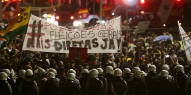 BRASILIA, BRAZIL - MAY 18: Protests erupt after embattled President Temer refuses to resign on May 18, 2017 in Brasilia, Brazil. A recording of Temer was released in which he allegedly condones bribery payments to Eduardo Cunha, the former President of the Chamber of Deputies. Cunha was involved in the 'Lava Jato' (Car Wash) corruption scandal and sentenced to 15 years in prison after being found guilty of corruption, money laundering and illegal money transfers abroad. With the release of the recording, the opposition has called for Temer's impeachment and new elections. (Photo by Igo Estrela/Getty Images) BRASILIA, BRAZIL - MAY 18: Protests erupt after embattled President Temer refuses to resign on May 18, 2017 in Brasilia, Brazil. A recording of Temer was released in which he allegedly condones bribery payments to Eduardo Cunha, the former President of the Chamber of Deputies. Cunha was involved in the 'Lava Jato' (Car Wash) corruption scandal and sentenced to 15 years in prison after being found guilty of corruption, money laundering and illegal money transfers abroad. With the release of the recording, the opposition has called for Temer's impeachment and new elections. (Photo by Igo Estrela/Getty Images)