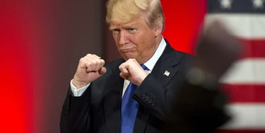 FILE - In this Jan. 28, 2016, file photo, Republican presidential candidate Donald Trump poses with a ring given to him by a group of veterans during a campaign event on the campus of Drake University in Des Moines, Iowa. (AP Photo/Jae C. Hong, File) FILE - In this Jan. 28, 2016, file photo, Republican presidential candidate Donald Trump poses with a ring given to him by a group of veterans during a campaign event on the campus of Drake University in Des Moines, Iowa. (AP Photo/Jae C. Hong, File)