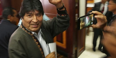 In this Nov. 27, 2019 photo, Bolivia's former President Evo Morales pumps his fist after a press conference at the journalists club in Mexico City. Morales went into exile in Mexico after he was prodded by police and the military, forcing him to resigned on Nov. 10, after he claimed victory in an election that international observers invited in by the government said was marred by numerous irregularities. (AP Photo/Marco Ugarte)