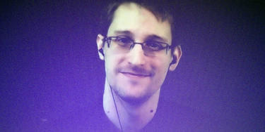 Former U.S. National Security Agency contractor Edward Snowden, who is in Moscow, is seen on a giant screen during a live video conference for an interview as part of Amnesty International's annual Write for Rights campaign at the Gaite Lyrique in Paris, France, Dec. 10, 2014. (AP Photo/Charles Platiau, Pool) Former U.S. National Security Agency contractor Edward Snowden, who is in Moscow, is seen on a giant screen during a live video conference for an interview as part of Amnesty International's annual Write for Rights campaign at the Gaite Lyrique in Paris, France, Dec. 10, 2014. (AP Photo/Charles Platiau, Pool)