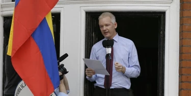 Julian Assange, founder of WikiLeaks makes a statement from a balcony of the Equador Embassy in London, Sunday, Aug. 19, 2012. Assange called on United States President Barack Obama to end a "witch hunt" against the secret-spilling WikiLeaks organization.(AP Photo/Kirsty Wigglesworth)