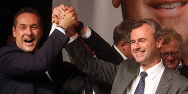 Heinz-Christian Strache, head of Austria's Freedom Party, FPOE, left, congratulates Norbert Hofer, candidate for Austria's Presidency during an after presidential election party in Vienna, Austria, Sunday, May 22, 2016. 