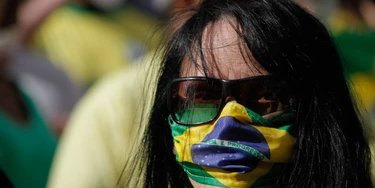 Supporters of Brazilian President Jair Bolsonaro close Avenida Paulista, in the central region of the city of Sao Paulo, Brazil, on May 3, 2020, during an act in support of the president and for the reopening of trade and against Sao Paulo governor Joao Doria, who extended the quarantine in the state to prevent the spread of the new coronavirus (covid-19), which occurs through contact and clusters of people. The quarantine continues until May 10. (Photo by Fabio Vieira/FotoRua/NurPhoto via Getty Images) Supporters of Brazilian President Jair Bolsonaro close Avenida Paulista, in the central region of the city of Sao Paulo, Brazil, on May 3, 2020, during an act in support of the president and for the reopening of trade and against Sao Paulo governor Joao Doria, who extended the quarantine in the state to prevent the spread of the new coronavirus (covid-19), which occurs through contact and clusters of people. The quarantine continues until May 10. (Photo by Fabio Vieira/FotoRua/NurPhoto via Getty Images)
