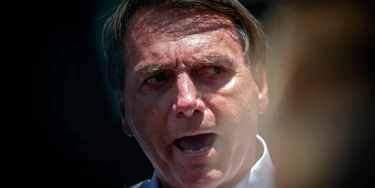 Brazilian President Jair Bolsonaro speaks to the press after voting during the second round of municipal elections at the Rosa da Fonseca Municipal School, in the Military Village, Rio de Janeiro, Brazil, on November 29, 2020. - Brazilians go to the polls Sunday to chose mayors in 57 cities, including Sao Paulo and Rio de Janeiro, the most rich and populated, in a runoff marked by the economic crisis and an upsurge of the new coronavirus. (Photo by Andre Coelho / AFP) (Photo by ANDRE COELHO/AFP via Getty Images) Brazilian President Jair Bolsonaro speaks to the press after voting during the second round of municipal elections at the Rosa da Fonseca Municipal School, in the Military Village, Rio de Janeiro, Brazil, on November 29, 2020. - Brazilians go to the polls Sunday to chose mayors in 57 cities, including Sao Paulo and Rio de Janeiro, the most rich and populated, in a runoff marked by the economic crisis and an upsurge of the new coronavirus. (Photo by Andre Coelho / AFP) (Photo by ANDRE COELHO/AFP via Getty Images)