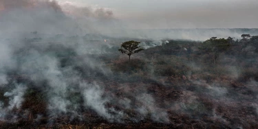 TOPSHOT - Aerial view of a forest fire in Porto Jofre, Pantanal, Mato Grosso state, Brazil, on September 5, 2021. - The Amazon basin has, until recently, absorbed large amounts of humankind's ballooning carbon emissions, helping stave off the nightmare of unchecked climate change. But studies indicate the rainforest is hurtling toward a "tipping point," at which it will dry up and turn to savannah, its 390 billion trees dying off en masse. Already, the destruction is quickening, especially since far-right President Jair Bolsonaro took office in 2019 in Brazil -- home to 60 percent of the Amazon -- with a push to open protected lands to agribusiness and mining. (Photo by CARL DE SOUZA / AFP) (Photo by CARL DE SOUZA/AFP via Getty Images)