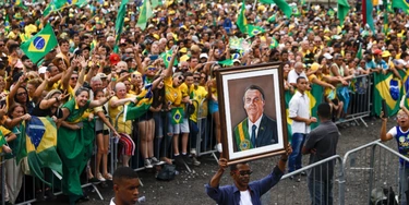 SAO GONCALO, BRAZIL - OCTOBER 18: A supporter displays a painting of President of Brazil and presidential candidate Jair Bolsonaro during a rally organized by Liberal Party as part of the campaign ahead of presidential run-off on October 18, 2022 in Sao Goncalo, Brazil. (Photo by Buda Mendes/Getty Images) SAO GONCALO, BRAZIL - OCTOBER 18: A supporter displays a painting of President of Brazil and presidential candidate Jair Bolsonaro during a rally organized by Liberal Party as part of the campaign ahead of presidential run-off on October 18, 2022 in Sao Goncalo, Brazil. (Photo by Buda Mendes/Getty Images)