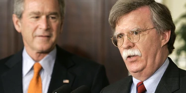 WASHINGTON - AUGUST 1: (L-R) U.S. President George W. Bush listens to John Bolton speak after being appointed to be ambassador to the United Nations during an event at the White House August 1, 2005 in Washington, DC. Bush has the power to fill vacancies without Senate approval while Congress is in recess. (Photo by Mark Wilson/Getty Images) WASHINGTON - AUGUST 1: (L-R) U.S. President George W. Bush listens to John Bolton speak after being appointed to be ambassador to the United Nations during an event at the White House August 1, 2005 in Washington, DC. Bush has the power to fill vacancies without Senate approval while Congress is in recess. (Photo by Mark Wilson/Getty Images)