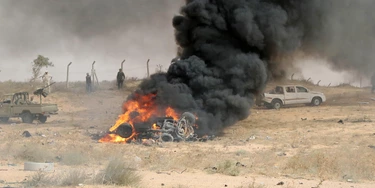 Forces loyal to Libya's UN-backed unity government gather at the site of a car-bomb attack carried out by an Islamic State (IS) group jihadist at the western entrance of Sirte on June 2, 2016.
According to Libyan officials fighting resumed on June 1 on the outskirts of Sirte between their forces and jihadist during which three pro-government troops had been killed and 10 more wounded. Sirte was the hometown of slain dictator Moamer Kadhafi and, since seizing it in June last year, IS has turned it into a recruitment and training camp / AFP / MAHMUD TURKIA (Photo credit should read MAHMUD TURKIA/AFP/Getty Images) Forces loyal to Libya's UN-backed unity government gather at the site of a car-bomb attack carried out by an Islamic State (IS) group jihadist at the western entrance of Sirte on June 2, 2016.
According to Libyan officials fighting resumed on June 1 on the outskirts of Sirte between their forces and jihadist during which three pro-government troops had been killed and 10 more wounded. Sirte was the hometown of slain dictator Moamer Kadhafi and, since seizing it in June last year, IS has turned it into a recruitment and training camp / AFP / MAHMUD TURKIA (Photo credit should read MAHMUD TURKIA/AFP/Getty Images)