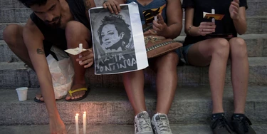 People light candles during a demonstration against the murder of councilwoman and activist Marielle Franco, in front of Rio de Janeiro's Legislative House on March 16, 2018. Brazilians mourned for second consecutive day a Rio de Janeiro councilwoman, black rights activist and outspoken critic of police brutality who was shot in an assassination-style killing on March 14. / AFP PHOTO / Mauro Pimentel (Photo credit should read MAURO PIMENTEL/AFP/Getty Images) People light candles during a demonstration against the murder of councilwoman and activist Marielle Franco, in front of Rio de Janeiro's Legislative House on March 16, 2018. Brazilians mourned for second consecutive day a Rio de Janeiro councilwoman, black rights activist and outspoken critic of police brutality who was shot in an assassination-style killing on March 14. / AFP PHOTO / Mauro Pimentel (Photo credit should read MAURO PIMENTEL/AFP/Getty Images)