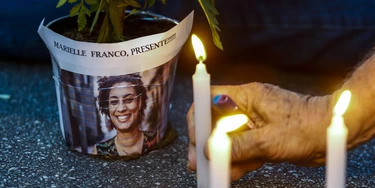 An elderly man lights a candle during a rally against the murder of Brazilian councilwoman and activist Marielle Franco, in Sao Paulo Brazil on March 15, 2018.Brazilians mourned for the Rio de Janeiro councilwoman and outspoken critic of police brutality who was shot in the city center in an assassination-style killing on the eve. / AFP PHOTO / Miguel SCHINCARIOL (Photo credit should read MIGUEL SCHINCARIOL/AFP/Getty Images) An elderly man lights a candle during a rally against the murder of Brazilian councilwoman and activist Marielle Franco, in Sao Paulo Brazil on March 15, 2018.Brazilians mourned for the Rio de Janeiro councilwoman and outspoken critic of police brutality who was shot in the city center in an assassination-style killing on the eve. / AFP PHOTO / Miguel SCHINCARIOL (Photo credit should read MIGUEL SCHINCARIOL/AFP/Getty Images)