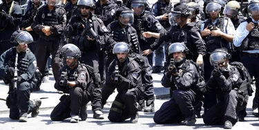 Israeli police forces hold stun grenades launchers following Friday noon prayer outside Jerusalem's old city on July 28, 2017.Israel barred men under 50 from prayers at a sensitive Jerusalem holy site, with more clashes feared after Palestinians ended a boycott of the compound and entered for the first time in two weeks. / AFP PHOTO / Jack GUEZ (Photo credit should read JACK GUEZ/AFP/Getty Images)