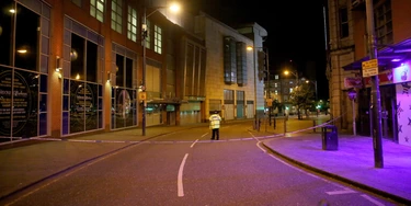 MANCHESTER, ENGLAND - MAY 23:  A police officer guards the scene near Manchester Arena on May 23, 2017 in Manchester, England.  An explosion occurred at Manchester Arena as concert goers were leaving the venue after Ariana Grande had performed.  Greater Manchester Police have confirmed 19 fatalities and at least 50 injured. (Photo by Christopher Furlong/Getty Images) MANCHESTER, ENGLAND - MAY 23:  A police officer guards the scene near Manchester Arena on May 23, 2017 in Manchester, England.  An explosion occurred at Manchester Arena as concert goers were leaving the venue after Ariana Grande had performed.  Greater Manchester Police have confirmed 19 fatalities and at least 50 injured. (Photo by Christopher Furlong/Getty Images)