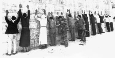 File - In this June 8, 1967 file photo, Israeli soldiers search Jordanian prisoners during mopping up operations in the old city of Jerusalem, as the city came under Jewish control during the Six-Day War. It may well be remembered as a pyrrhic victory for Israel: a six-day war in which it vanquished several Arab armies, only to be saddled with a 50-year fight with the Palestinians for the Holy Land. A half century after the watershed 1967 Mideast war, many in Israel think the lighting victory planted the seeds of doom.  (AP Photo)