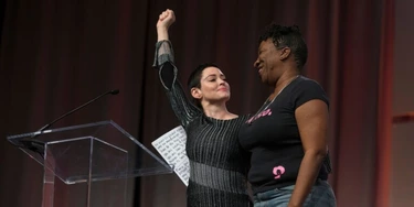 US actress Rose McGowan and Founder of #MeToo Campaign Tarana Burke, embrace on stage at the Women's March / Women's Convention in Detroit, Michigan, on October 27, 2017. A stream of actress including Rose McGowan, models and ex-employees have come out, many anonymously, to accuse Hollywood producer Harvey Weinstein of sexual harassment and abuse dating as far back as the 1990s. / AFP PHOTO / RENA LAVERTY (Photo credit should read RENA LAVERTY/AFP/Getty Images) US actress Rose McGowan and Founder of #MeToo Campaign Tarana Burke, embrace on stage at the Women's March / Women's Convention in Detroit, Michigan, on October 27, 2017. A stream of actress including Rose McGowan, models and ex-employees have come out, many anonymously, to accuse Hollywood producer Harvey Weinstein of sexual harassment and abuse dating as far back as the 1990s. / AFP PHOTO / RENA LAVERTY (Photo credit should read RENA LAVERTY/AFP/Getty Images)
