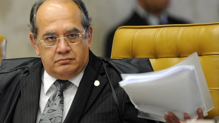 Brazilian Supreme Court Minister Gilmar Mendes during the session on the case of Italian Cesare Battisti in Brasilia, on June 8, 2011.Thirty years after fleeing Italy, former far-left militant Cesare Battisti will likely find out Wednesday whether he will be extradited to his native country on murder charges or remain in Brazil, perhaps as a free man. Italy wants Brazil to extradite Battisti, convicted in an Italian court in 1993 for the murders of four people in the 1970s when he was a member of the radical Armed Proletarians for Communism (PAC) group. AFP PHOTO/Evaristo SA (Photo credit should read EVARISTO SA/AFP/Getty Images)