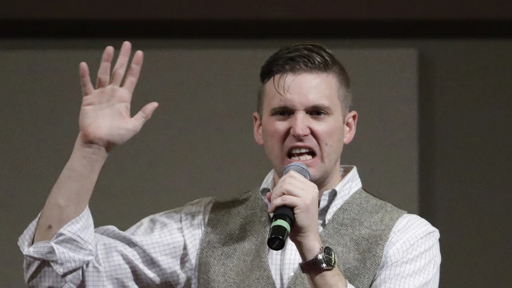 Richard Spencer, who leads a movement that mixes racism, white nationalism and populism, speaks at the Texas A&M University campus Tuesday, Dec. 6, 2016, in College Station, Texas. Texas A&M officials say they didn't schedule the speech by Spencer, who was invited to speak by a former student who reserved campus space available to the public. (AP Photo/David J. Phillip)