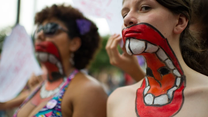 Women with their upper bodies painted pose as they take part in a protest against violence against women during the celebration of the International Women's Day on March 8, 2013, in Sao Paulo, Brazil. AFP PHOTO/YASUYOSHI CHIBA        (Photo credit should read YASUYOSHI CHIBA/AFP/Getty Images) Women with their upper bodies painted pose as they take part in a protest against violence against women during the celebration of the International Women's Day on March 8, 2013, in Sao Paulo, Brazil. AFP PHOTO/YASUYOSHI CHIBA        (Photo credit should read YASUYOSHI CHIBA/AFP/Getty Images)