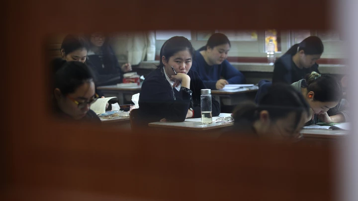 SEOUL, SOUTH KOREA - NOVEMBER 12:  South Korean students take their College Scholastic Ability Test at a school on November 12, 2014 in Seoul, South Korea. More than 630,000 high school seniors and graduates sit for the examinations at 1,212 test centers across the country, where academic records are all important. Success in the exam, one of the most rigourous standardized tests in the world, enables students to study at Korea's top universities.  (Photo by Chung Sung-Jun/Getty Images)