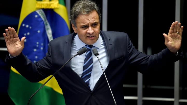 Brazilian senator Aecio Neves, from PSDB, delivers a speech during the debate in the Senate of a vote on suspending President Dilma Rousseff and launching an impeachment trial, in Brasilia on May 11, 2016. A simple majority in the 81-member Senate will trigger Rousseff's six-month suspension pending trial. A two-thirds majority would then be needed to remove her permanently. / AFP / EVARISTO SA (Photo credit should read EVARISTO SA/AFP/Getty Images) Brazilian senator Aecio Neves, from PSDB, delivers a speech during the debate in the Senate of a vote on suspending President Dilma Rousseff and launching an impeachment trial, in Brasilia on May 11, 2016. A simple majority in the 81-member Senate will trigger Rousseff's six-month suspension pending trial. A two-thirds majority would then be needed to remove her permanently. / AFP / EVARISTO SA (Photo credit should read EVARISTO SA/AFP/Getty Images)
