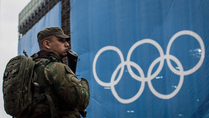 RIO DE JANEIRO, BRAZIL - AUGUST 08: A soldier keeps watch outside the Olympic beach volley ball venue at Copacabana Beach on August 8, 2016 in Rio de Janeiro, Brazil. Olympic team members, officials and other visitors have reported a rash of robberies in recent days in spite of a heavy police presence near Olympic venue sites.  (Photo by Chris McGrath/Getty Images) RIO DE JANEIRO, BRAZIL - AUGUST 08: A soldier keeps watch outside the Olympic beach volley ball venue at Copacabana Beach on August 8, 2016 in Rio de Janeiro, Brazil. Olympic team members, officials and other visitors have reported a rash of robberies in recent days in spite of a heavy police presence near Olympic venue sites.  (Photo by Chris McGrath/Getty Images)