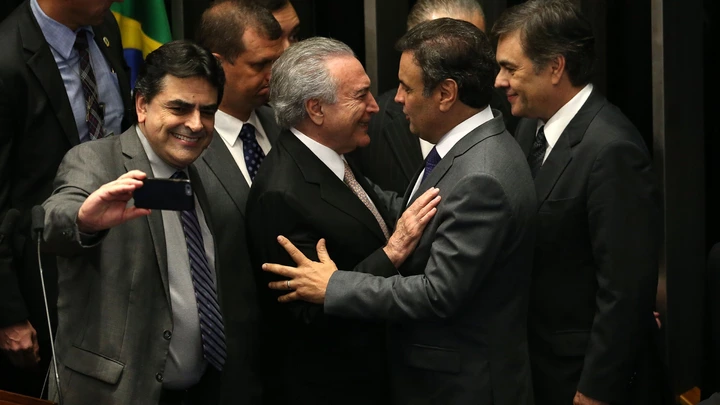 (160831) -- BRASILIA, Aug. 31, 2016 (Xinhua) -- Michel Temer (C) greets with senator Aecio Neves following his swear-in ceremony as President of Brazil in Brasilia, Brazil, Aug. 31, 2016. Temer was sworn in as the new president of Brazil on Wednesday afternoon, after Dilma Rousseff was stripped of the presidency by the Senate in an impeachment trial. (Xinhua/Li Ming) (wr) (Photo by Xinhua/Sipa USA)