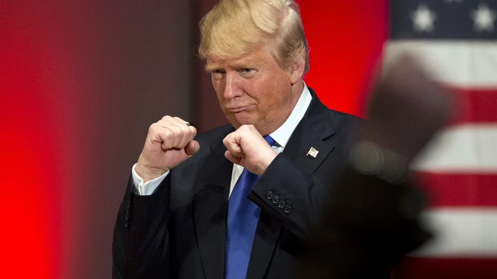 FILE - In this Jan. 28, 2016, file photo, Republican presidential candidate Donald Trump poses with a ring given to him by a group of veterans during a campaign event on the campus of Drake University in Des Moines, Iowa. (AP Photo/Jae C. Hong, File) FILE - In this Jan. 28, 2016, file photo, Republican presidential candidate Donald Trump poses with a ring given to him by a group of veterans during a campaign event on the campus of Drake University in Des Moines, Iowa. (AP Photo/Jae C. Hong, File)
