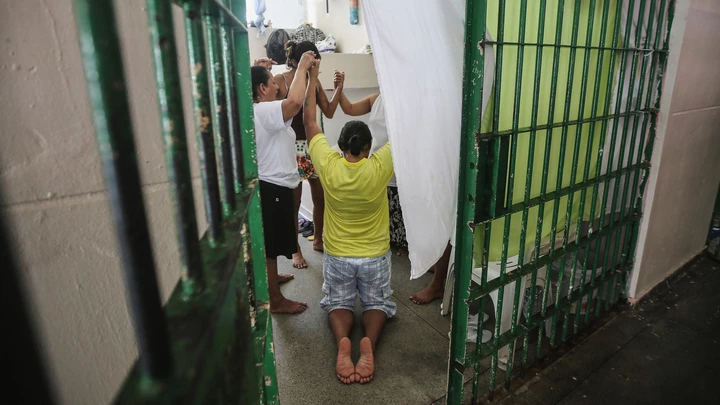 MANAUS, BRAZIL - FEBRUARY 17:  Inmates pray inside a cell in the women's section of the Anisio Jobim penitentiary complex on February 17, 2016 in Manaus, Brazil. The men's section of the prison holds over 1,200 inmates, more than twice as many as it was designed for. Brazil now holds the fourth-largest prison population in the world, behind the U.S., Russia and China, with the number of Brazilians behind bars nearly doubling in the past decade. The prison system currently holds more than 600,000 inmates, 61 percent over capacity, according to Human Rights Watch.  (Photo by Mario Tama/Getty Images) MANAUS, BRAZIL - FEBRUARY 17:  Inmates pray inside a cell in the women's section of the Anisio Jobim penitentiary complex on February 17, 2016 in Manaus, Brazil. The men's section of the prison holds over 1,200 inmates, more than twice as many as it was designed for. Brazil now holds the fourth-largest prison population in the world, behind the U.S., Russia and China, with the number of Brazilians behind bars nearly doubling in the past decade. The prison system currently holds more than 600,000 inmates, 61 percent over capacity, according to Human Rights Watch.  (Photo by Mario Tama/Getty Images)