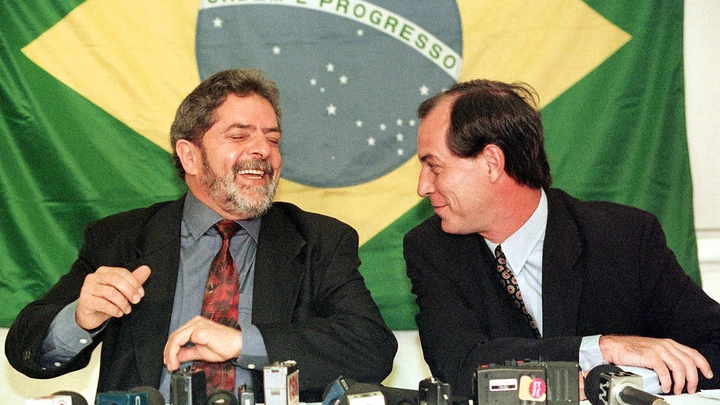 SAO PAULO, BRAZIL:  Brazilian presidential candidates Luiz Inacio Lula da Silva(L) of the Workers Party and Ciro Gomes(R) of the Popular Socialist Party laugh during a joint press conference in a hotel of Sao Paulo, Brazil, 28 September. The latest polls leading to Brazil's 04 October presidential elections put Lula in second position with 25 percent of the votes while Gomes is third with nine percent. Current president Fernando Henrique Cardoso leads both of them with 46 percent. AFP PHOTO   Marie HIPPENMEYER (Photo credit should read MARIE HIPPENMEYER/AFP/Getty Images)