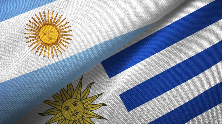 Uruguay and Argentina flags together textile cloth, fabric texture Uruguay and Argentina flags together textile cloth, fabric texture