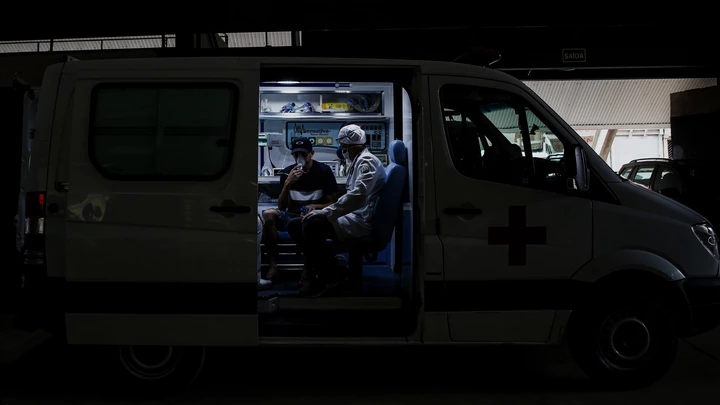 Ricardo Vieira, 41 years old surgeon attends a resident of Paraisopolis, Felipe dos Santos, 23 years old unemployed on April 7, 2020 in Sao Paulo, Brazil.  Ricardo Vieira, 41 years old surgeon attends a resident of Paraisopolis, Felipe dos Santos, 23 years old unemployed on April 7, 2020 in Sao Paulo, Brazil.