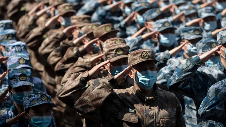 Military medics salute to the Huoshenshan Hospital in Wuhan, central China's Hubei Province, April 15, 2020. With the approval of Xi Jinping, chairman of the Central Military Commission, military medics who were dispatched to Hubei Province to assist with the treatment of COVID-19 patients have left the provincial capital city of Wuhan after completing their mission.