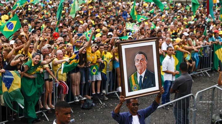 SAO GONCALO, BRAZIL - OCTOBER 18: A supporter displays a painting of President of Brazil and presidential candidate Jair Bolsonaro during a rally organized by Liberal Party as part of the campaign ahead of presidential run-off on October 18, 2022 in Sao Goncalo, Brazil. (Photo by Buda Mendes/Getty Images)
