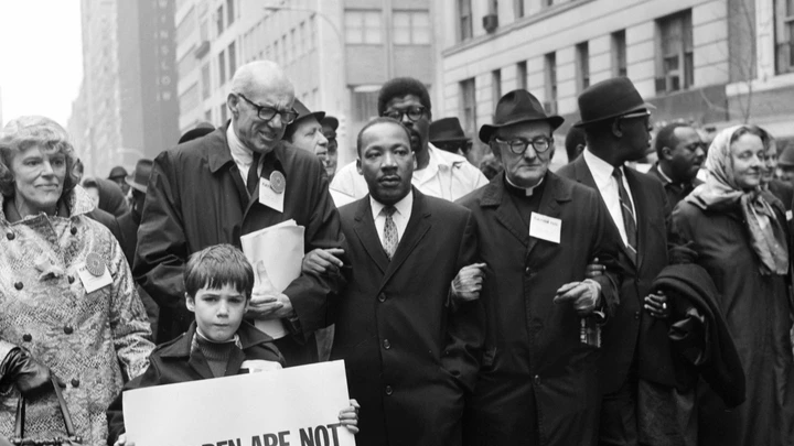 NEW YORK, UNITED STATES:  Civil rights leader Rev. Martin Luther King, Jr., (C) is accompanied by famed pediatrician Dr. Benjamin Spock (2nd-L), Father Frederick Reed (3rd-R) and union leader Cleveland Robinson (2nd-R) 16 March, 1967, during an anti-Vietnam War demonstration in New York. The US is celebrating in 2004 what would have been King's 75th birthday. King was assassinated on 04 April, 1968, in Memphis, Tennessee. AFP PHOTO (Photo credit should read AFP/AFP/Getty Images) NEW YORK, UNITED STATES:  Civil rights leader Rev. Martin Luther King, Jr., (C) is accompanied by famed pediatrician Dr. Benjamin Spock (2nd-L), Father Frederick Reed (3rd-R) and union leader Cleveland Robinson (2nd-R) 16 March, 1967, during an anti-Vietnam War demonstration in New York. The US is celebrating in 2004 what would have been King's 75th birthday. King was assassinated on 04 April, 1968, in Memphis, Tennessee. AFP PHOTO (Photo credit should read AFP/AFP/Getty Images)