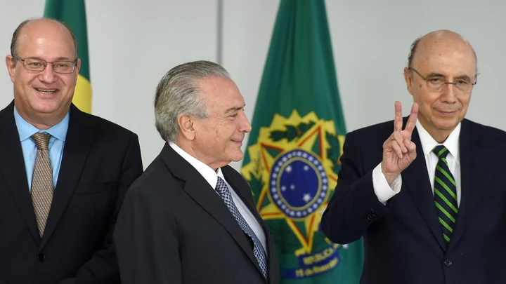 Brazilian acting President Michel Temer (C), Finance Minister Henrique Meirelles (R) and Ilan Goldfajn, appointed president to the Central Bank pose for photographers during a meeting at Planalto Palace in Brasilia on May 17, 2016. / AFP / EVARISTO SA        (Photo credit should read EVARISTO SA/AFP/Getty Images) Brazilian acting President Michel Temer (C), Finance Minister Henrique Meirelles (R) and Ilan Goldfajn, appointed president to the Central Bank pose for photographers during a meeting at Planalto Palace in Brasilia on May 17, 2016. / AFP / EVARISTO SA        (Photo credit should read EVARISTO SA/AFP/Getty Images)