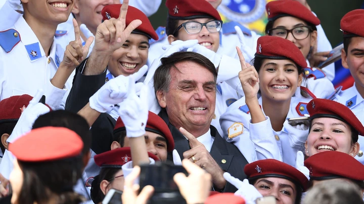 Brazilian congressman and presidential canditate for the next presidential election, Jair Bolsonaro (C), poses for pictures with students of Brasilia's Military School after a parade on the Brazilian Army commemorative day,in Brasilia, on April 19, 2018. (Photo by EVARISTO SA / AFP)        (Photo credit should read EVARISTO SA/AFP/Getty Images) Brazilian congressman and presidential canditate for the next presidential election, Jair Bolsonaro (C), poses for pictures with students of Brasilia's Military School after a parade on the Brazilian Army commemorative day,in Brasilia, on April 19, 2018. (Photo by EVARISTO SA / AFP)        (Photo credit should read EVARISTO SA/AFP/Getty Images)
