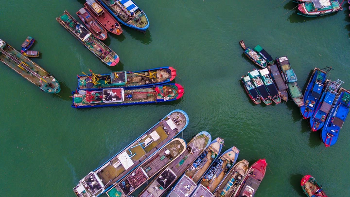 SANYA, CHINA - AUGUST 16: Fishing boats set sail from a harbor to catch fish in the South China Sea on August 16, 2017 in Sanya, Hainan Province of China. About 18,000 fishing boats set sail from Hainan to South China Sea for fishing on Wednesday. (Photo by Luo Yunfei/CHINA NEWS SERVICE/VCG via Getty Images)