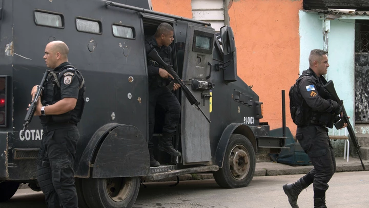 Military Police officers patrol during an operation at "Cidade de Deus" (City of God) favela in Rio de Janeiro, Brazil, on May 03, 2018. (Photo by MAURO PIMENTEL / AFP)        (Photo credit should read MAURO PIMENTEL/AFP/Getty Images)