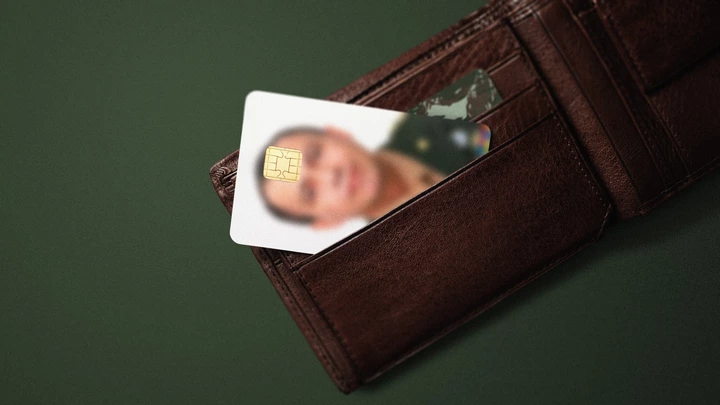 Blank white credit cards in leather wallet on denim background. Flat lay. Blank white credit cards in leather wallet on denim background. Flat lay.