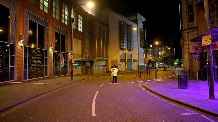 MANCHESTER, ENGLAND - MAY 23:  A police officer guards the scene near Manchester Arena on May 23, 2017 in Manchester, England.  An explosion occurred at Manchester Arena as concert goers were leaving the venue after Ariana Grande had performed.  Greater Manchester Police have confirmed 19 fatalities and at least 50 injured. (Photo by Christopher Furlong/Getty Images)