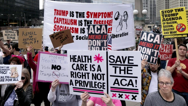 Protesters gather across the Chicago River from Trump Tower to rally against the repeal of the Affordable Care Act Friday, March 24, 2017, in Chicago. Earlier, President Donald Trump and GOP leaders yanked their bill to repeal "Obamacare" off the House floor Friday when it became clear it would fail badly. (AP Photo/Charles Rex Arbogast) Protesters gather across the Chicago River from Trump Tower to rally against the repeal of the Affordable Care Act Friday, March 24, 2017, in Chicago. Earlier, President Donald Trump and GOP leaders yanked their bill to repeal "Obamacare" off the House floor Friday when it became clear it would fail badly. (AP Photo/Charles Rex Arbogast)