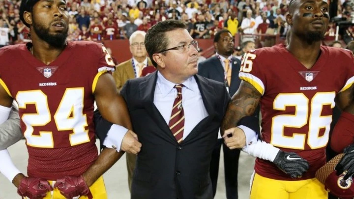 Washington Redskins Owner Daniel Synder stands with cornerback Josh Norman (24) and cornerback Bashaud Breeland (26) during the the national anthem before the NFL football game against the Oakland Raiders at FedExField on Sept. 24, 2017 in Landover, Md. Washington Redskins Owner Daniel Synder stands with cornerback Josh Norman (24) and cornerback Bashaud Breeland (26) during the the national anthem before the NFL football game against the Oakland Raiders at FedExField on Sept. 24, 2017 in Landover, Md.